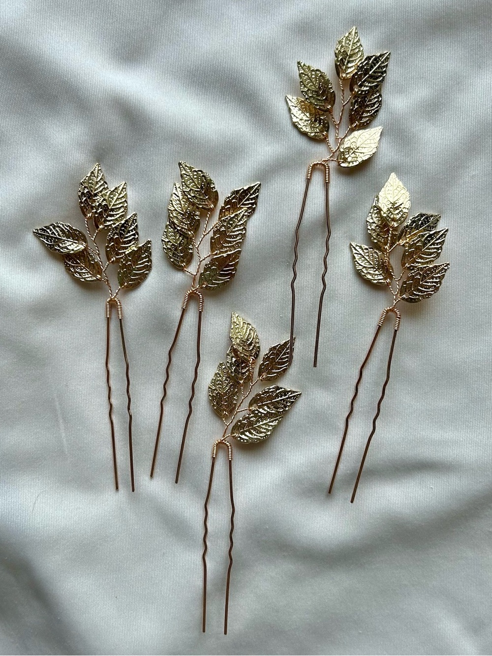 NWOT 10-Piece Hairpin Set. Gold color, leaf design. 4”. Bendable.